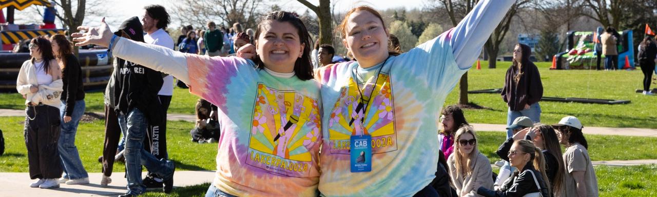 Two students wearing matching Lakerpalooza shirts